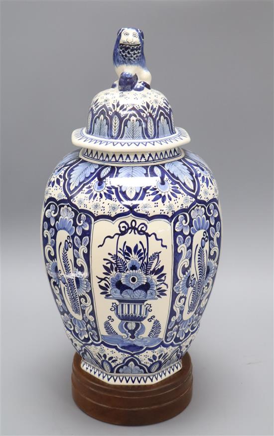 A Delft blue and white lidded vase, with wooden stand height 41cm excl. stand